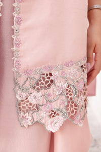Huma Mistry Official Mia designer handbag in vibrant pink with gold accents and a structured shape.